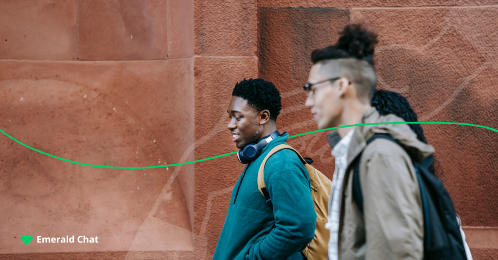 image of two males walking together