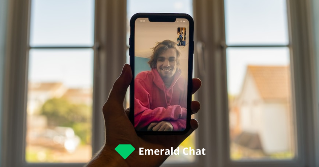 picture of a hand holding a phone with video chat